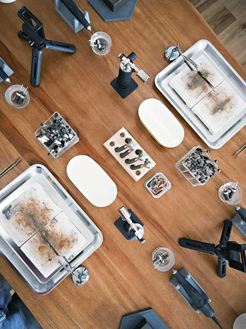 Jewellery tools laid out on a timber bench