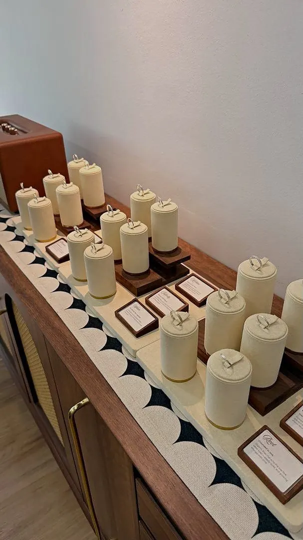 Silver rings on cream display stands